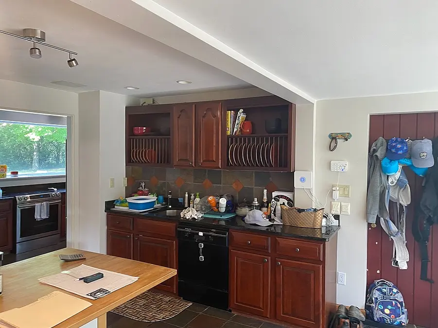 Mequon kitchen before remodeling with work areas distributed across divided spaces