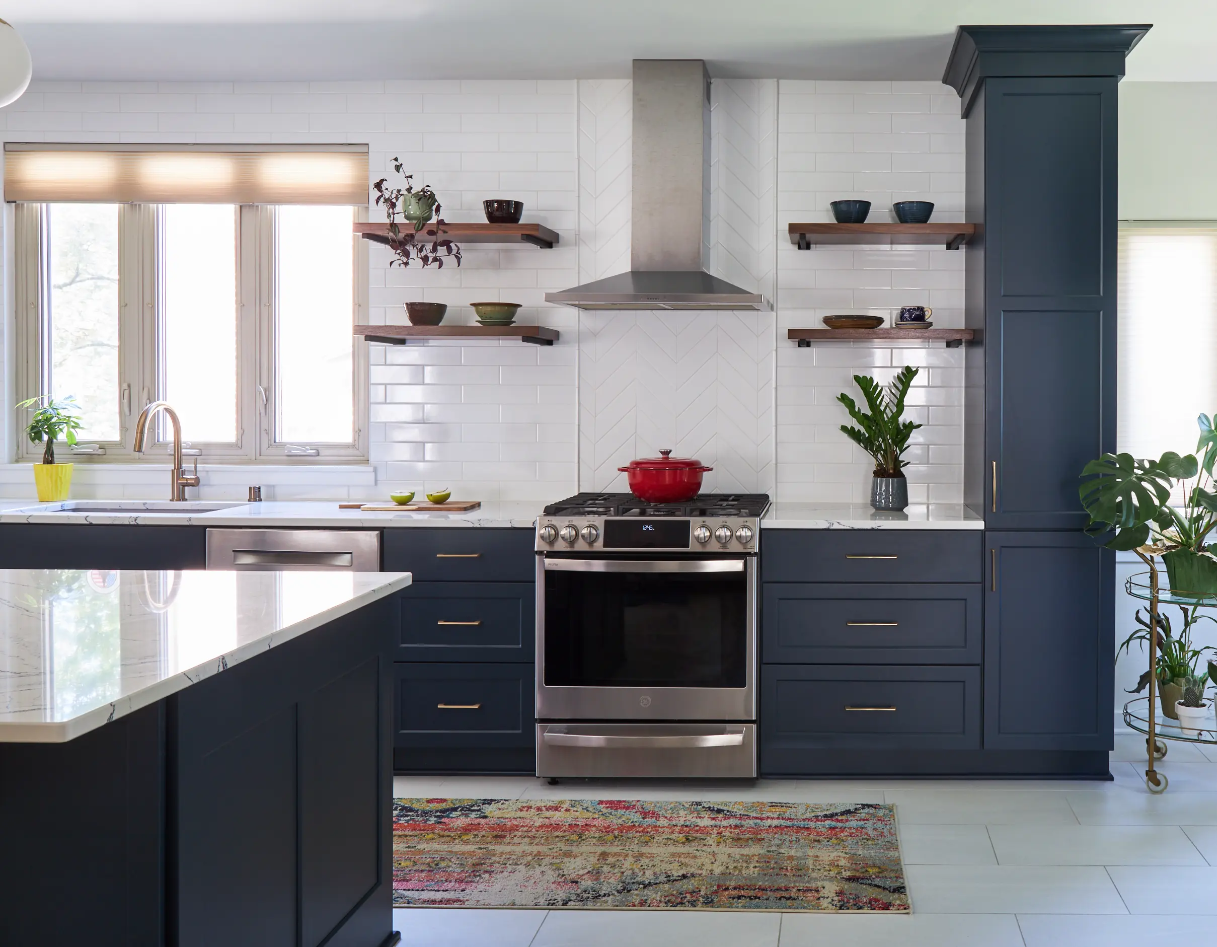 Shorewood kitchen with drawer storage, tall cabinetry, task lighting, and connected work surfaces